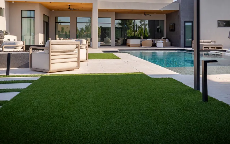 Finished backyard with artificial turf and pool