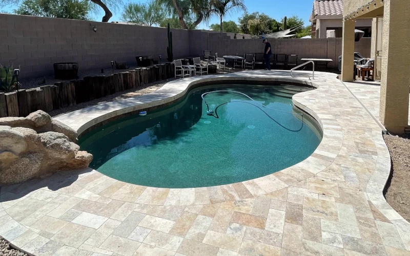 Custom in-ground pool with natural rock accent